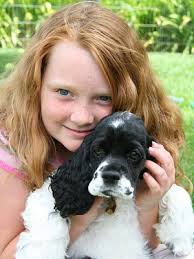 Family holding puppy