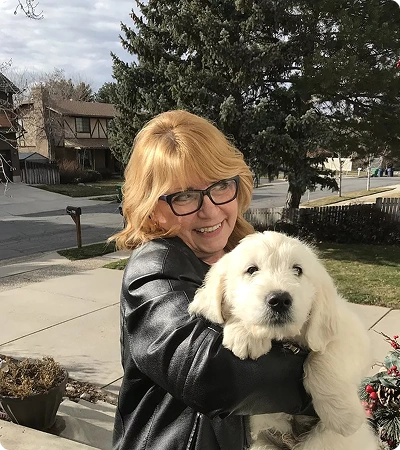 Customer holding cocker spaniel